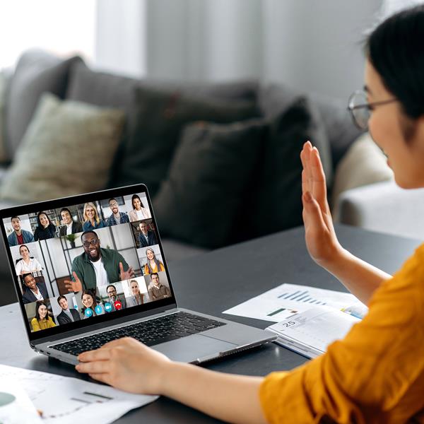 Woman working from home and participating in conference call